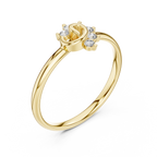 Gold ring with diamond accents on a white background