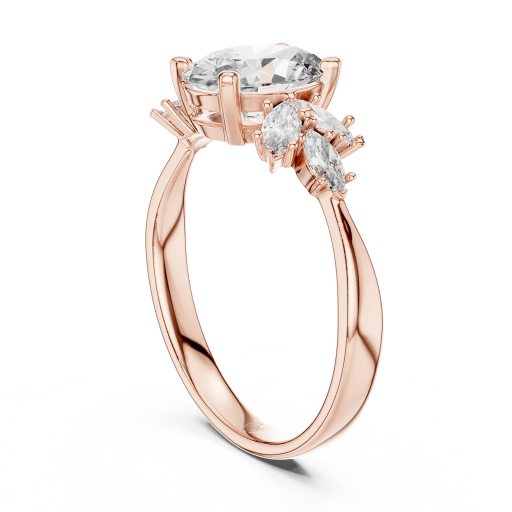 Rose gold ring with oval and marquise cut clear gemstones on white background