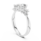 Elegant silver engagement ring with large round center stone and side marquise-cut stones