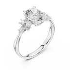 Oval cut gemstone ring with marquise side stones on a polished silver band, elegant design