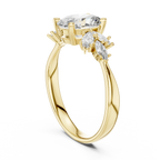 Gold ring with large oval and marquise-cut clear gemstones on a white background
