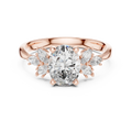 Oval cut diamond engagement ring with rose gold band and marquise side stones