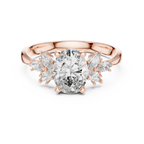 Oval cut diamond engagement ring with rose gold band and marquise side stones