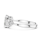 Side view of a white gold engagement ring with a large rectangular diamond and tapered baguette accents