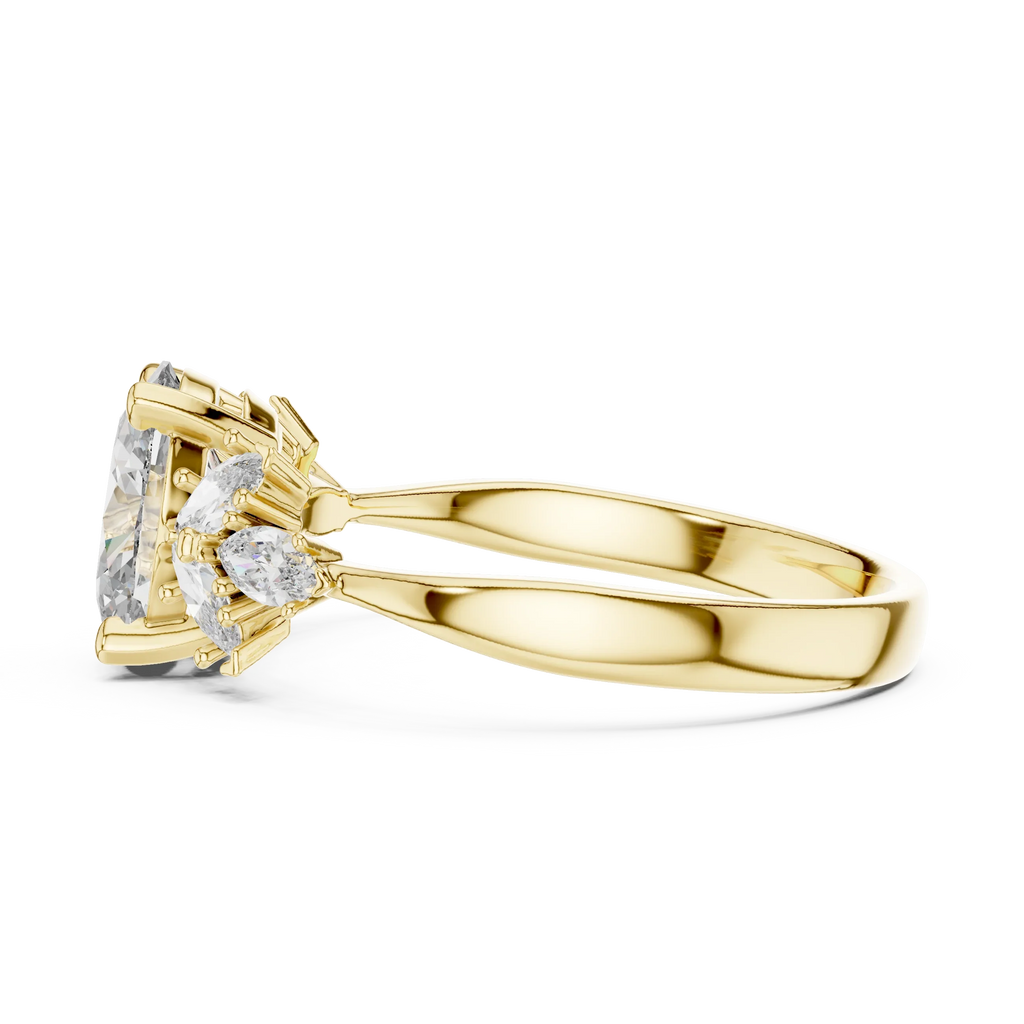 Yellow gold ring with split band and cluster of marquise and pear-cut clear gemstones