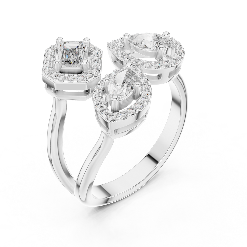 Silver ring with three diamond-shaped stones on a white background