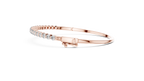 Side profile of rose gold diamond bangle with secure clasp detail