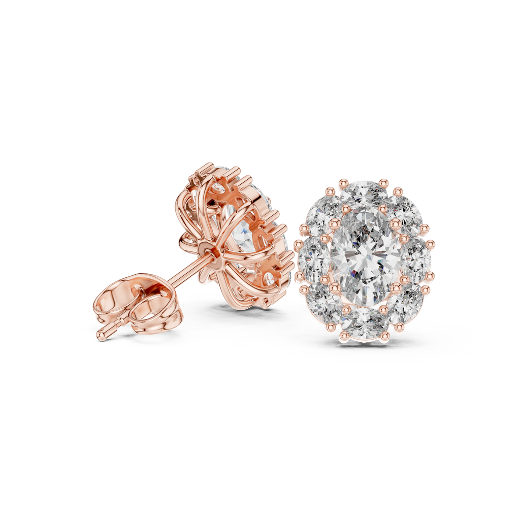 Rose gold and silver earrings on a white background