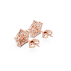 Rose gold geometric earrings on a white background