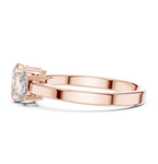 Rose gold oval trilogy engagement ring prong setting side profile