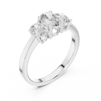 Angled white gold three stone oval proposal ring with brilliant sparkle
