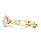 Side View: Yellow gold prong set oval ring with refined feminine silhouette
