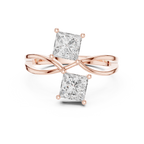 Rose gold ring with two princess-cut diamonds on a white background