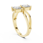 Gold ring with two diamonds on a white background