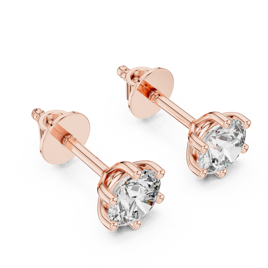 Close up round brilliant moissanite studs in rose gold prong setting