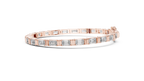 Elegant rose gold tennis bracelet with emerald cut diamonds