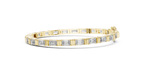 Gold bracelet with diamond accents on a white background