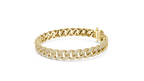 Gold chain bracelet on a white background