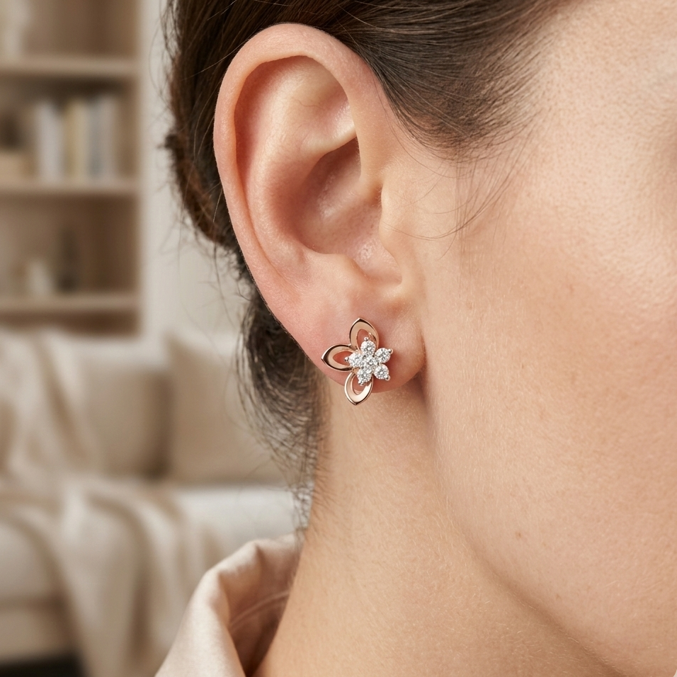 Close-up of a woman wearing a floral earring with a blurred indoor background