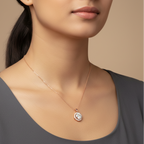 Close-up of a woman wearing a gold necklace with a diamond pendant on a beige background