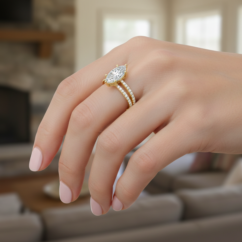 Close-up of a hand wearing a diamond ring with a blurred indoor background
