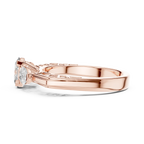 Rose Gold Three Stone Ring with Oval Center and Pear Side Moissanites – Side View
