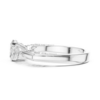 White Gold Three Stone Ring with Oval Center and Pear Side Moissanites – Side View