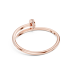 Rose gold ring with diamond accents on a white background
