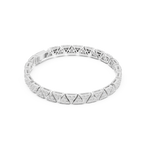 Silver bracelet with geometric design on a white background