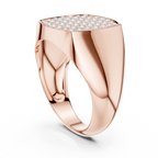 Rose gold ring with diamond-encrusted top on a white background