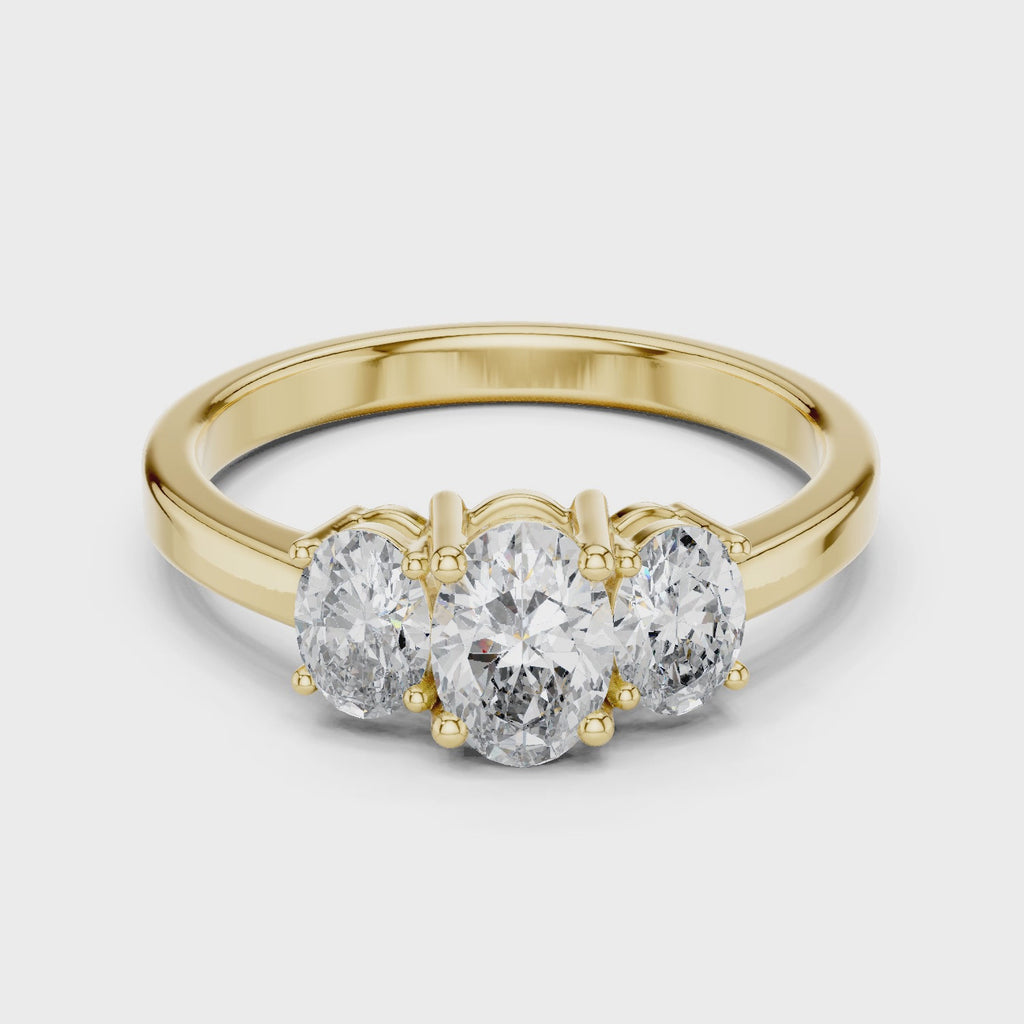 Yellow gold oval trilogy moissanite ring full rotation sparkle
