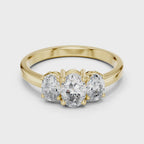 Yellow gold oval trilogy moissanite ring full rotation sparkle
