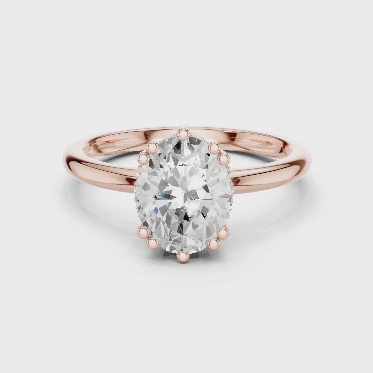 rose gold oval hidden halo engagement ring 360 rotation
