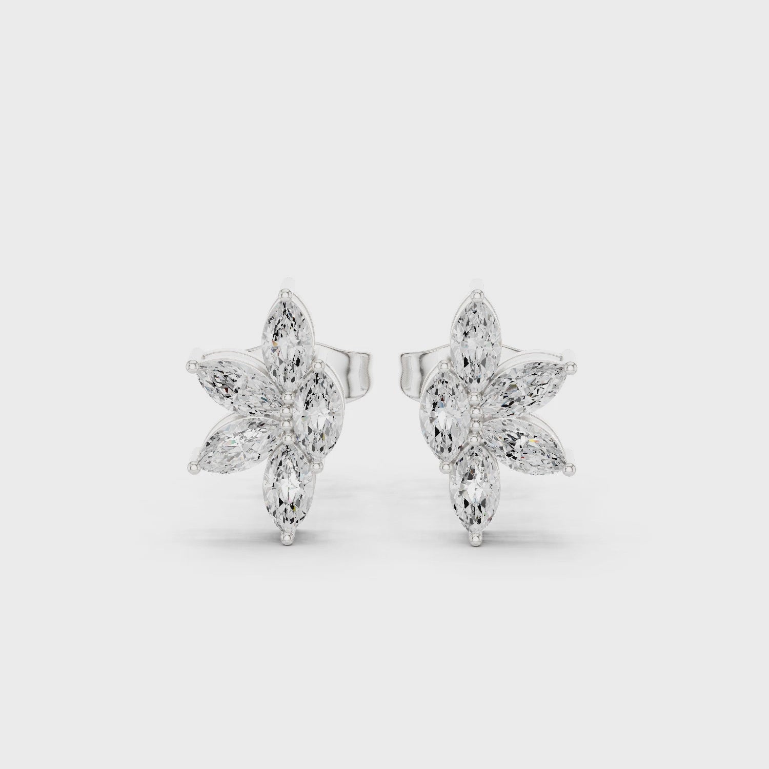 White gold moissanite floral stud earrings 360 degree rotating view
