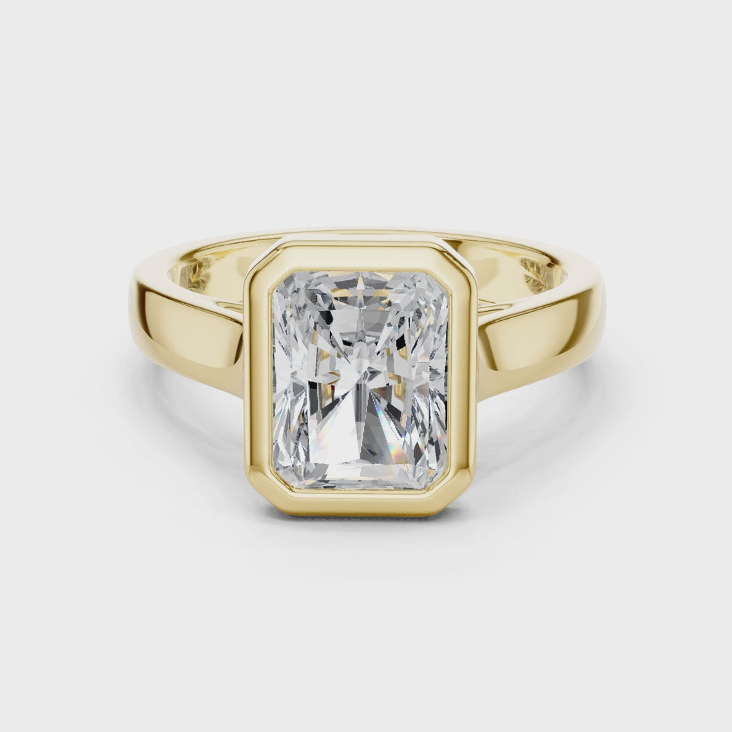 Full rotation video of yellow gold men’s radiant statement ring with structured frame