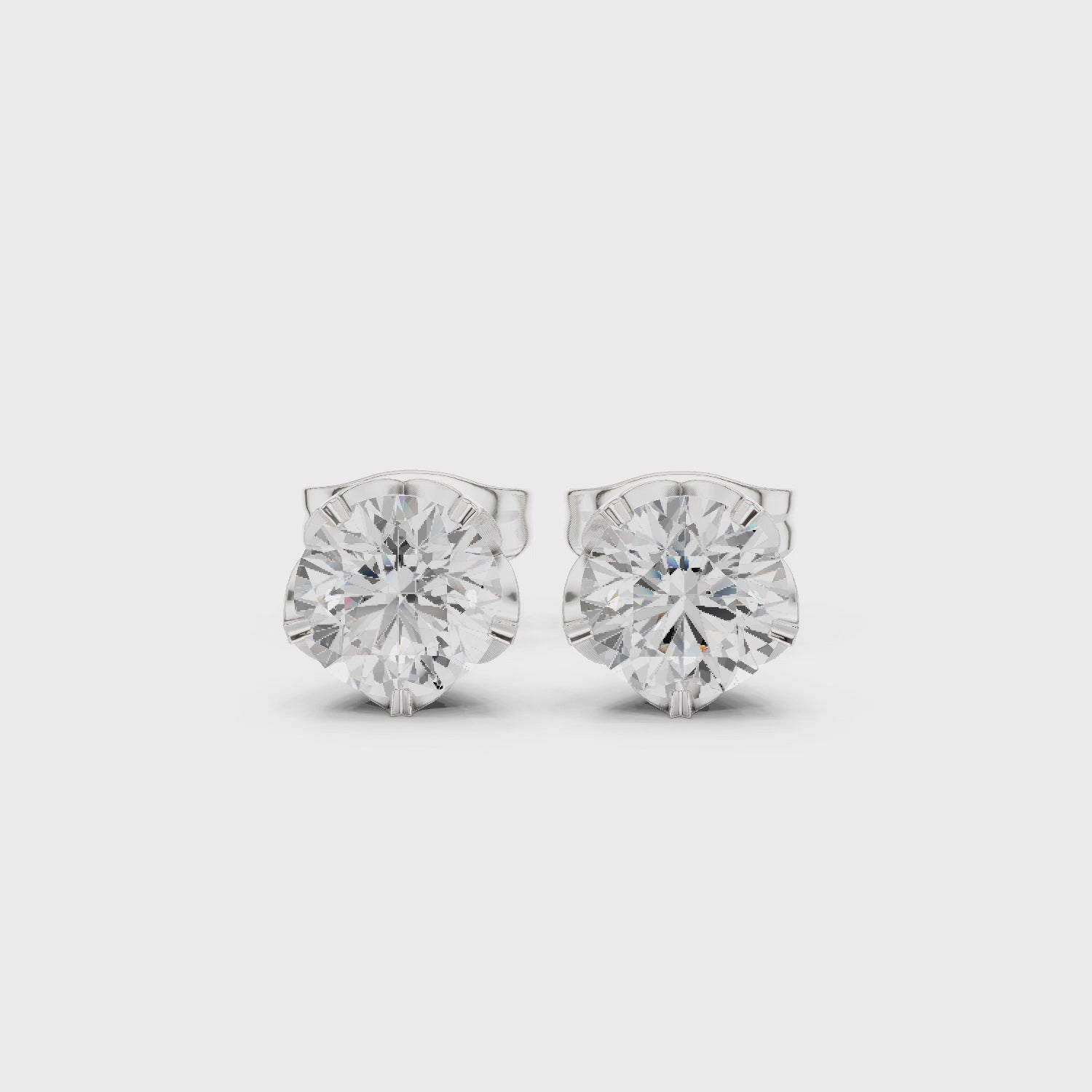 white gold round lotus moissanite stud earrings 360 rotating video
