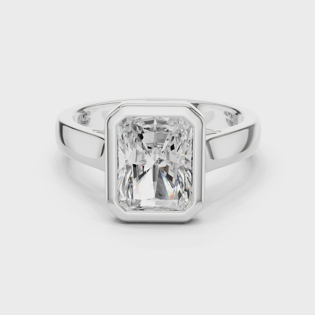 360 degree rotating white gold radiant cut men’s bezel ring showing full band detailing