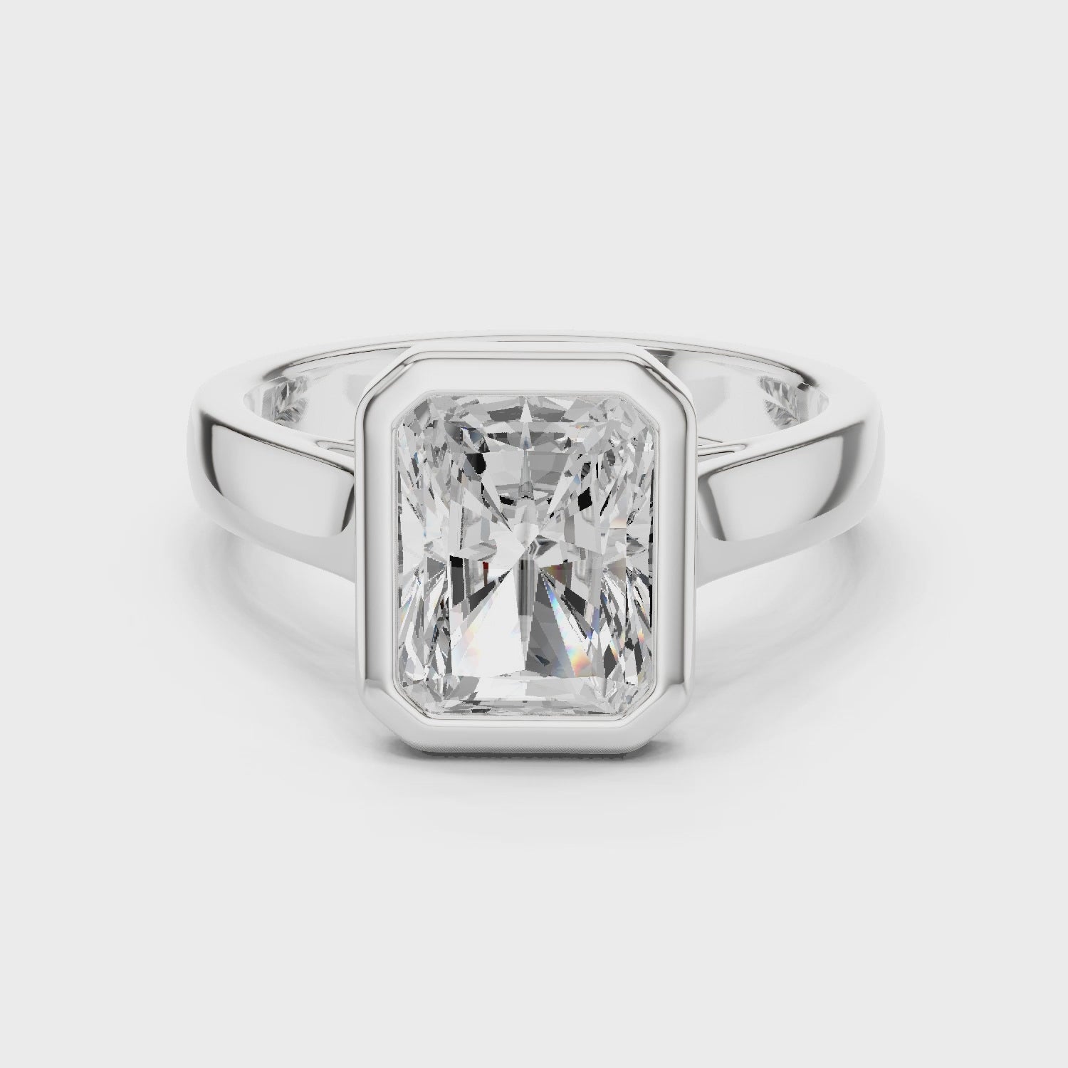 360 degree rotating white gold radiant cut men’s bezel ring showing full band detailing